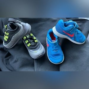 Toddler Nike shoes, black and grey are size 6c, blue and orange are size 7C.